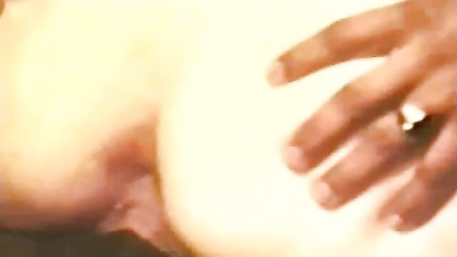 Blurry closeup of hand with wedding ring on pale shaved pussy