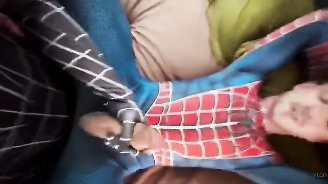 Two Spider-Man studs in tight suits handcuff each other in hot gay fetish play
