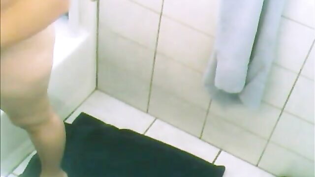 Spy cam of busty aunty nude in hot shower, thick thighs and ass