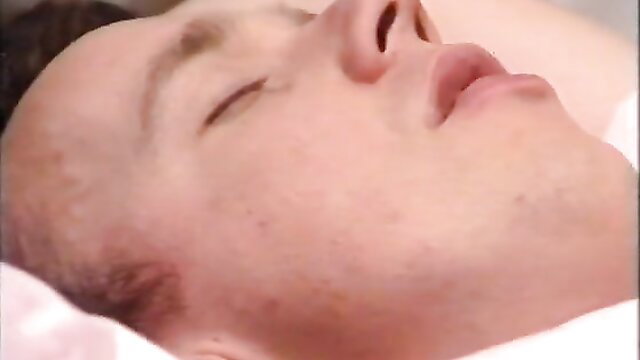 Closeup of shaved head man sleeping with parted lips in retro porn