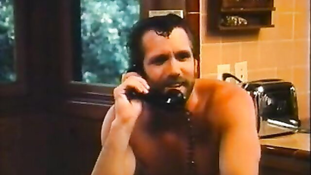 Muscular shirtless hunk on retro phone call in steamy VHS kitchen scene