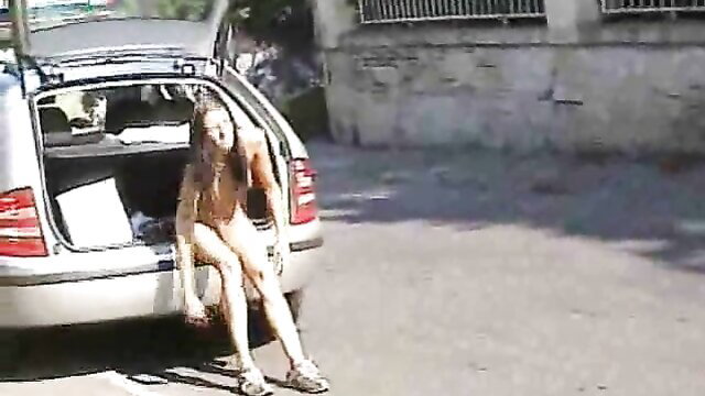 Slim brunette girlfriend nude flashing from car trunk publicly