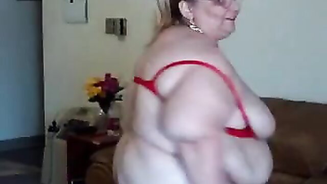 Curvy mature BBW flaunts massive tits in red bra on webcam