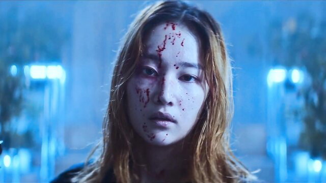 Bloody ballerina with wet blonde hair stares intensely in blue-lit scene