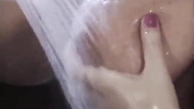 Asian woman in white lingerie with hand on wet pussy closeup