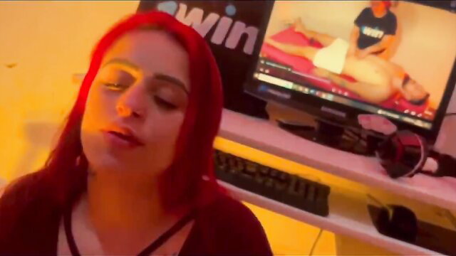 Hot ginger slut closeup face while watching cumshot porn on screen