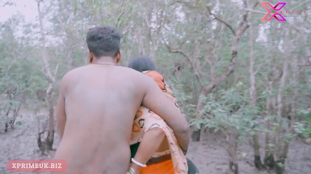 Nude Indian man embraces busty Bhabhi in outdoor forest tease