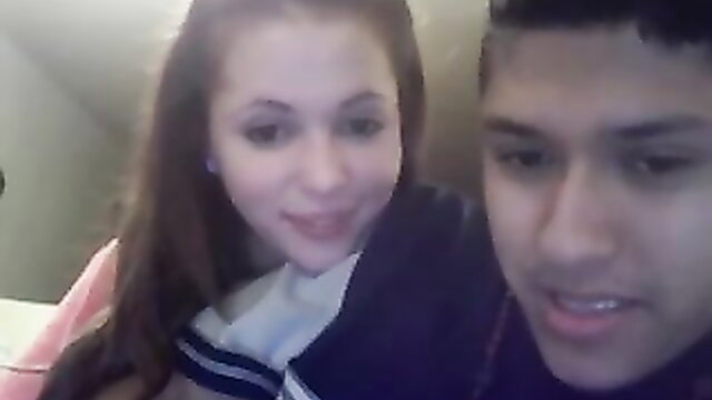 Teen GF in schoolgirl uniform sucks boyfriend's cock on webcam