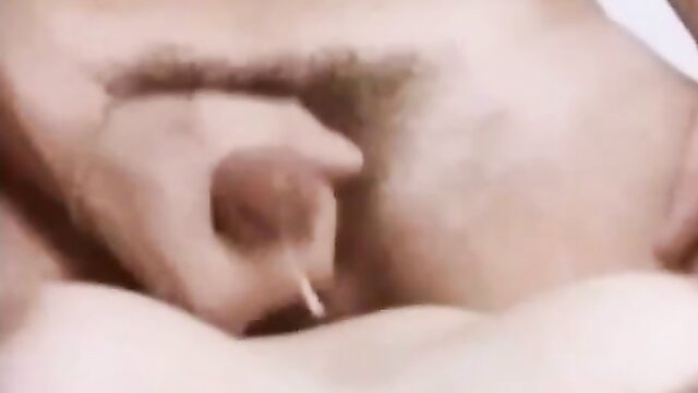 Retro gay closeup of hand stroking hard uncut cock in vintage XXX film