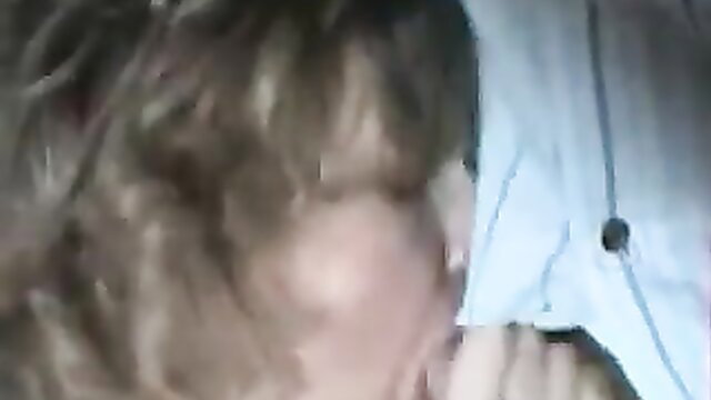 Closeup of blonde mom with glasses giving intense blowjob