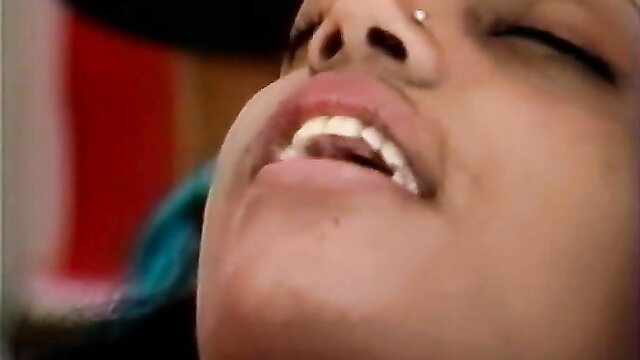 Closeup of Indian teen's ecstatic face with open mouth in steamy oral pleasure