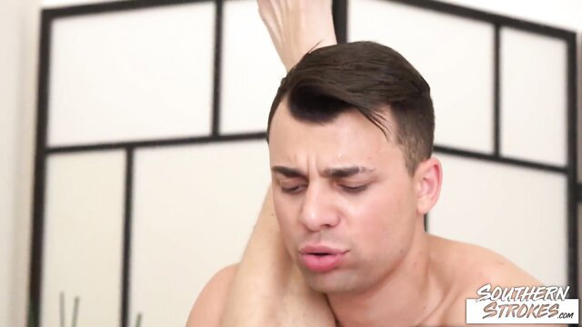 Nick Vargas nude, flexed arm, foot up, intense expression