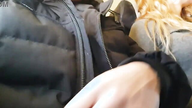 Blonde babe giving public airplane handjob in puffy jacket POV