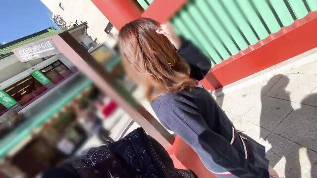 Shy Japanese Erika (18) walking by temple in grey sweater skirt on date