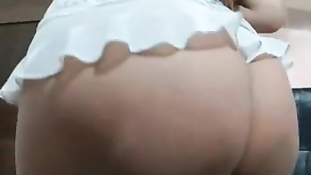 Big ass Asian babe in frilly white mini skirt bends over teasingly