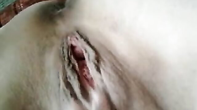 Closeup of woman fingering wet shaved pussy solo masturbation