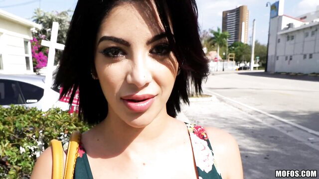 Kitty Caprice hot Latina in floral dress on sunny street