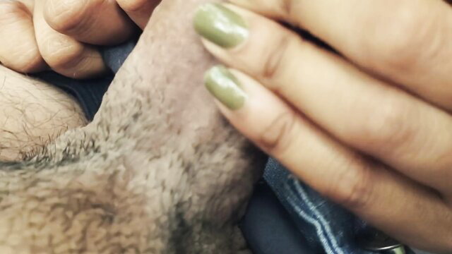 Sri Lankan woman's hand with green nails stroking hairy cock closeup