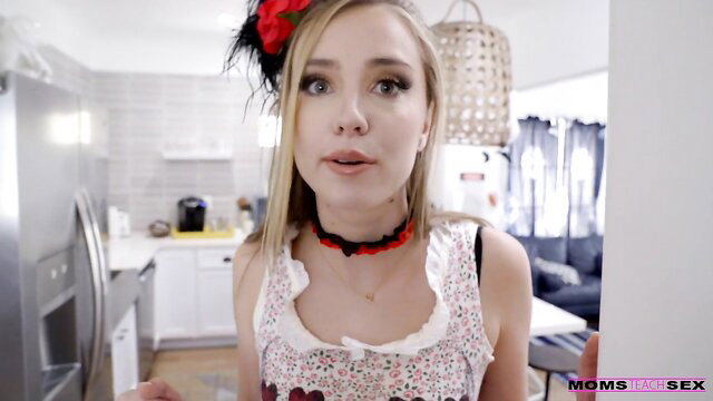 Haley Reed in sexy maid costume with red bow, teasing lips