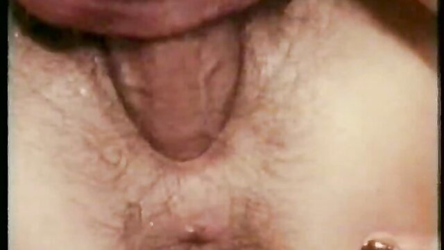 Classic porn closeup of woman's tongue licking man's hairy balls