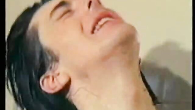 Man with black undercut hair grimacing in ecstasy, retro xxx thumbnail