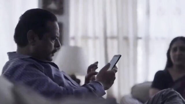 Indian aunty and man on couch in hot cuckold tease