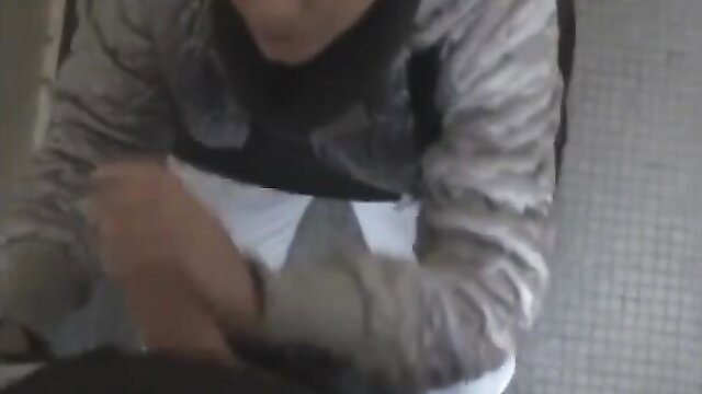 Smiling blonde woman in winter jacket on snowy Czech street near music club