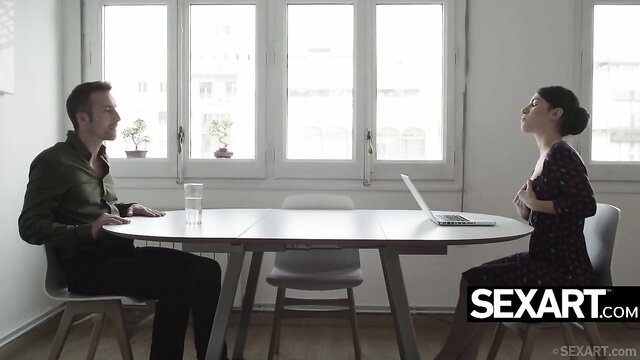 Brunette babe in dress at table with handsome man, steamy SexArt interview