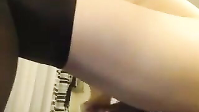 Sexy blonde tranny escort in stockings spreads legs wide