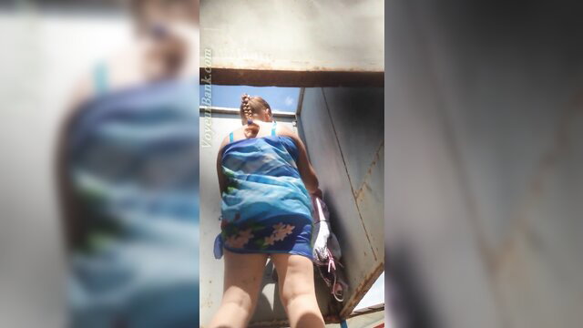 Hot mature babe in blue bikini bending over in cabin voyeur view