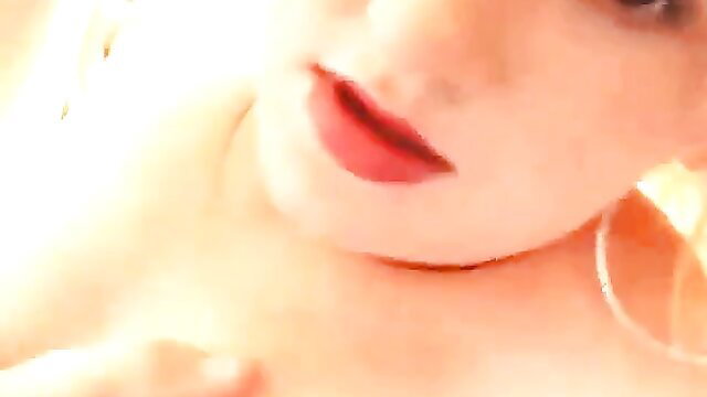 Closeup of chubby blonde babe's red lips and hoop earrings