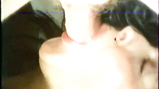 Closeup of woman's open mouth and neck in uncut French classic porn