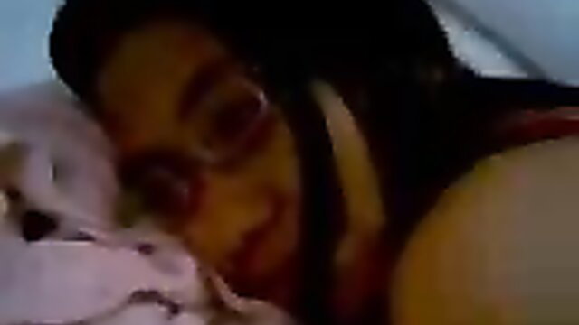 Malay girlfriend in glasses lying in bed craving hard dick