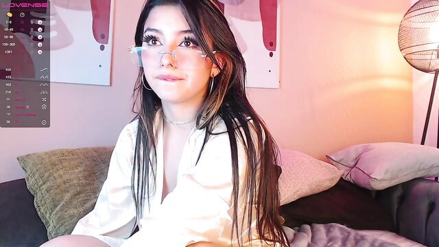 Asian babe in sheer robe smiles seductively with glasses on stream