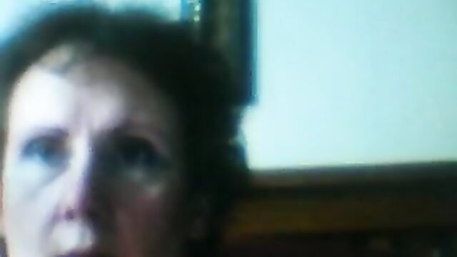 Blurry closeup of fat grandma's face pleasuring herself on webcam