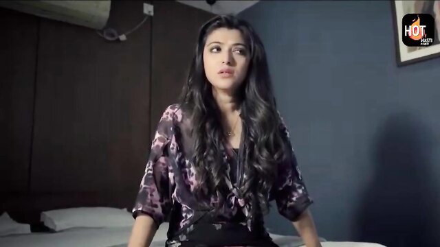 Indian babe Misal in sexy lingerie sitting on bed