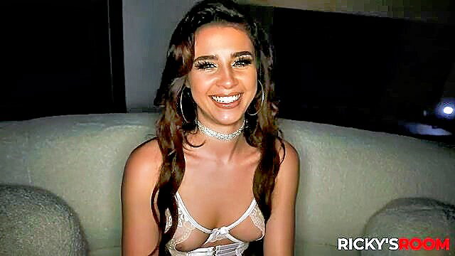 Kylie Rocket smiling in sexy white lingerie on Ricky's Room