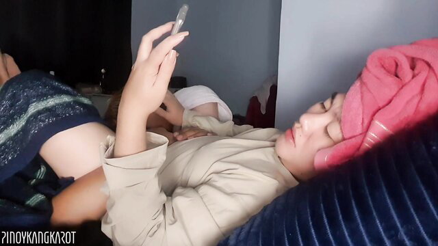 Hot Asian stepmom in towel lounging with stepson, sharing Indian sex tips