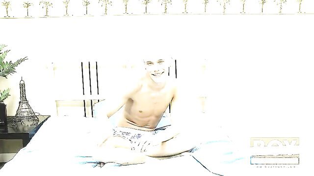 Blonde twink Ashton Cody shirtless in bed smiling, exclusive interview