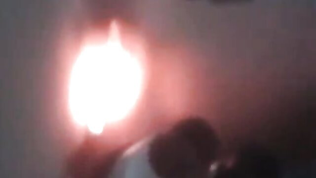 Brunette bent over exposing shaved pussy and ass with thick cum dripping down thighs near black dildos