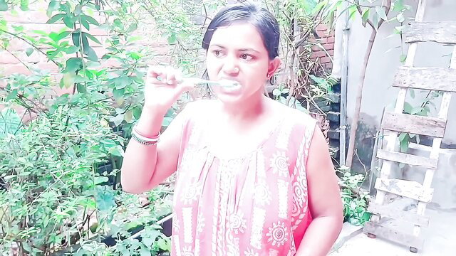Desi Indian college girl brushing teeth in sexy pink dress outdoors