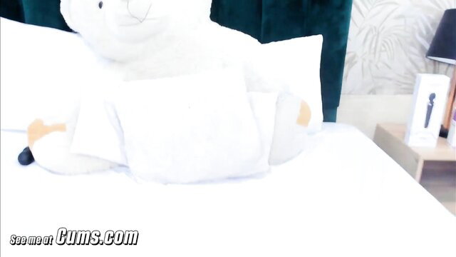 Hot redhead babe pleasures pussy with toy on bed