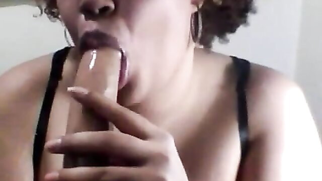 Curvy black woman deepthroating huge dildo with glossy lips