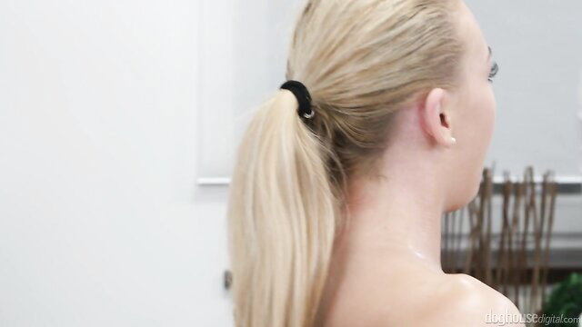 Blonde beauty with ponytail in high heels at massage