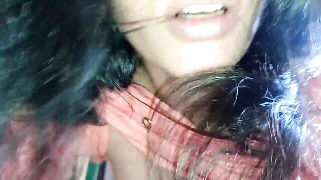Closeup of sexy Indian Desi girl's teasing lips and long black hair