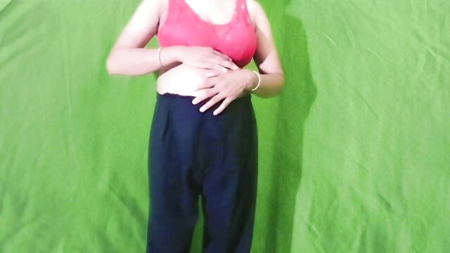 Curvy Indian babe in red bralette and pants, hands on belly