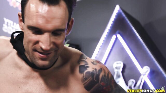 Muscular tattooed man in collar smiling at camera, Jenna Foxx thumbnail