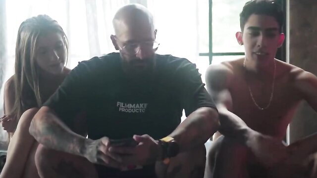 Sofia's first hardcore with Tomy: busty Latina, bald tatted guy, young nude stud threesome