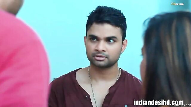 Indian couple in tight maroon kurta, intense eye contact