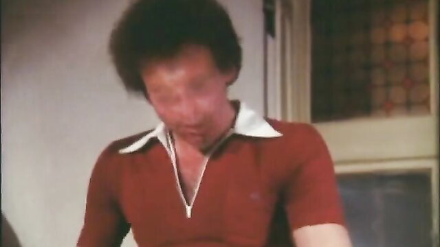 70s German guy in red shirt closeup, vintage adult video thumbnail